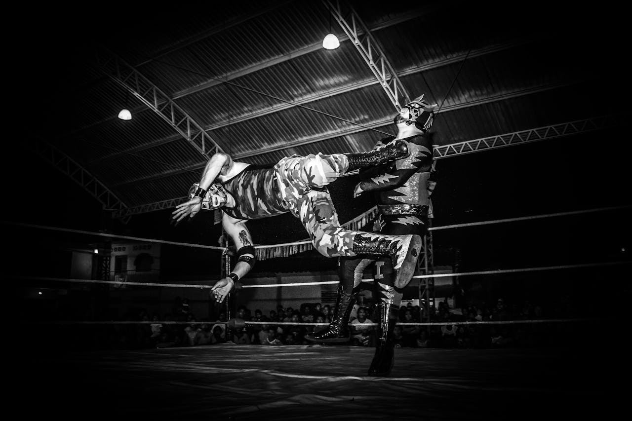 The Art of Drawing Readers In: Your attractive post title goes here Intense Lucha Libre wrestling match showcasing strength and agility under dramatic lighting.